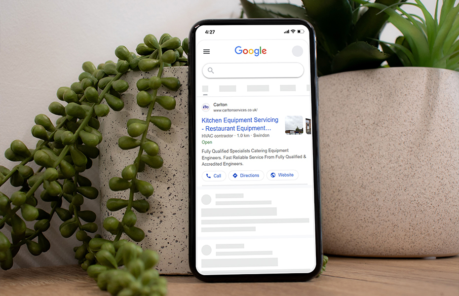 Mobile mockup of Google Ads for Carlton on desk