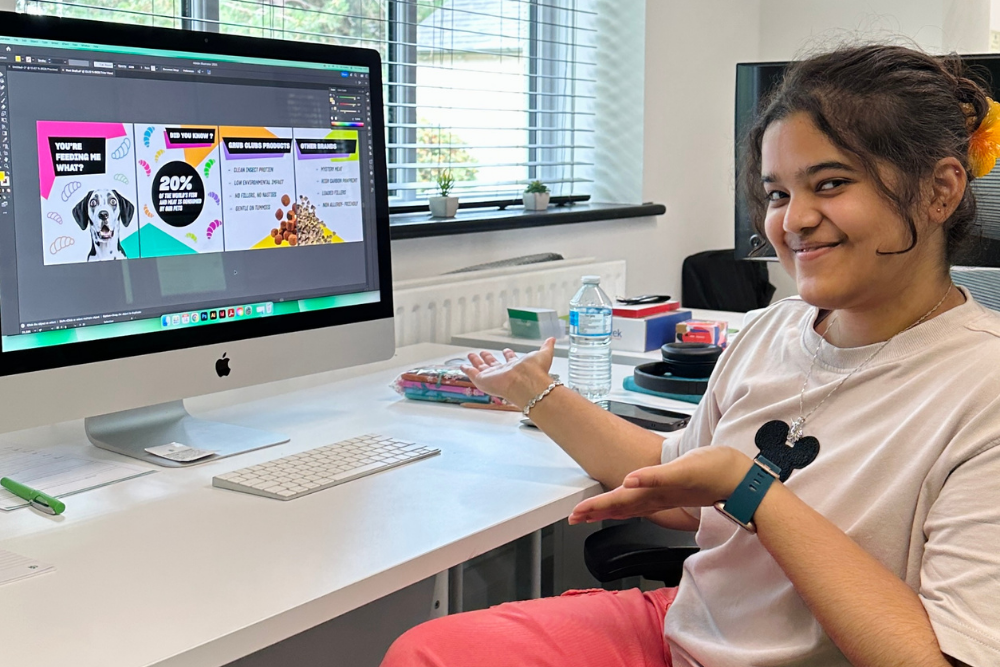 girl sat in front of computer